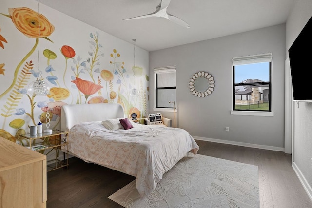 4525 Via Roma Pass, Leander, TX 78641 - bedroom with wood finished floors, baseboards, and a ceiling fan