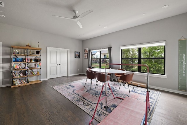 4525 Via Roma Pass, Leander, TX 78641 - dining area featuring healthy amount of natural light, baseboards, wood finished floors, and ceiling fan
