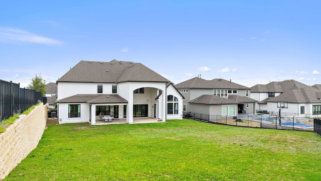 4525 Via Roma Pass, Leander, TX 78641 - back of property with a patio area, stucco siding, a fenced backyard, and a residential view