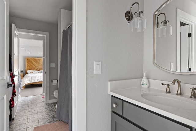 4525 Via Roma Pass, Leander, TX 78641 - ensuite bathroom featuring vanity, tile patterned floors, and curtained shower