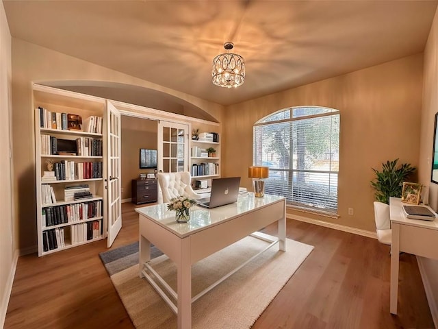613 Arrowhead Trl, Cedar Park, TX 78613 - office with wood finished floors, baseboards, and a chandelier