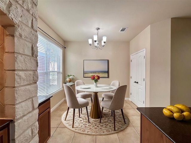 613 Arrowhead Trl, Cedar Park, TX 78613 - dining area with a chandelier, light tile patterned floors, and baseboards