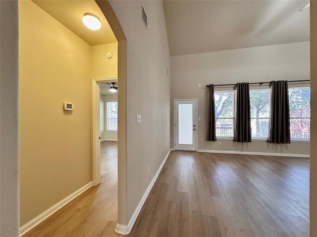 613 Arrowhead Trl, Cedar Park, TX 78613 - foyer entrance with arched walkways, wood finished floors, baseboards, and vaulted ceiling