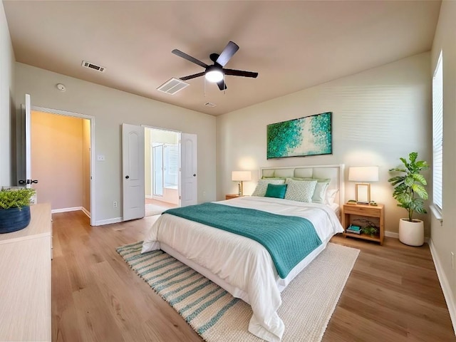613 Arrowhead Trl, Cedar Park, TX 78613 - bedroom with light wood finished floors, baseboards, and a ceiling fan