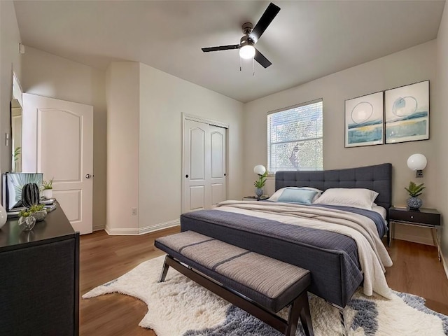 613 Arrowhead Trl, Cedar Park, TX 78613 - bedroom featuring wood finished floors, baseboards, a ceiling fan, and a closet
