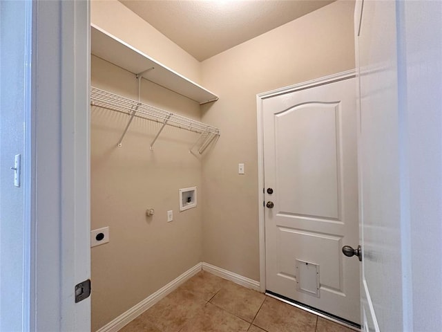 613 Arrowhead Trl, Cedar Park, TX 78613 - washroom with hookup for a washing machine, electric dryer hookup, light tile patterned floors, and baseboards