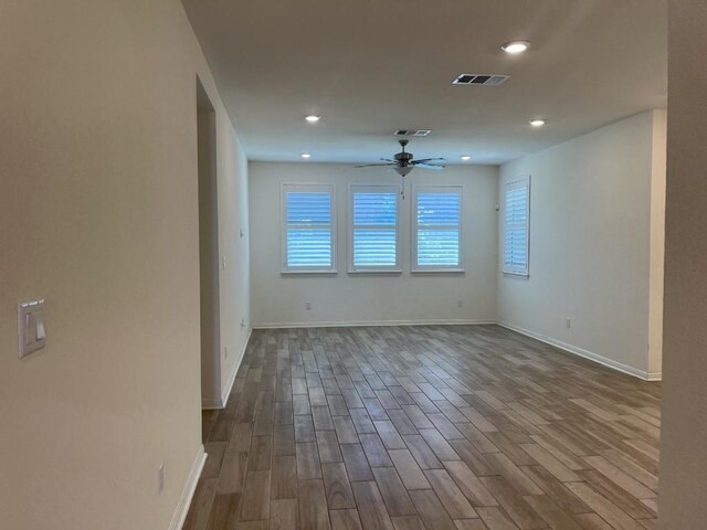19316 Fernando Trl, Austin, TX 78738 - unfurnished room featuring dark wood-type flooring, visible vents, a ceiling fan, and recessed lighting