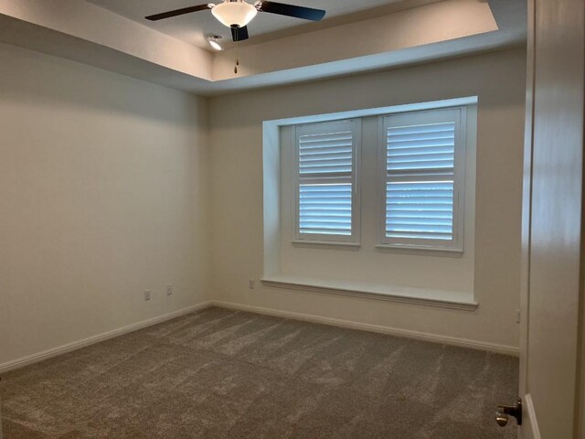 19316 Fernando Trl, Austin, TX 78738 - empty room with dark carpet, ceiling fan, and baseboards