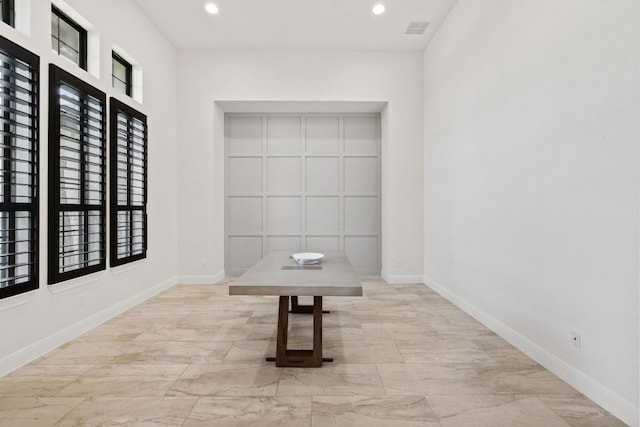interior space featuring recessed lighting, visible vents, and baseboards
