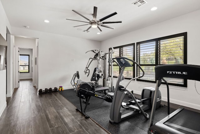 exercise room with ceiling fan, visible vents, recessed lighting, baseboards, and dark wood-style floors
