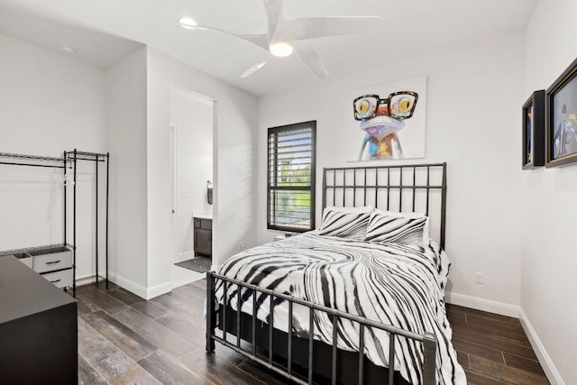 bedroom with ensuite bathroom, baseboards, a ceiling fan, and wood finish floors