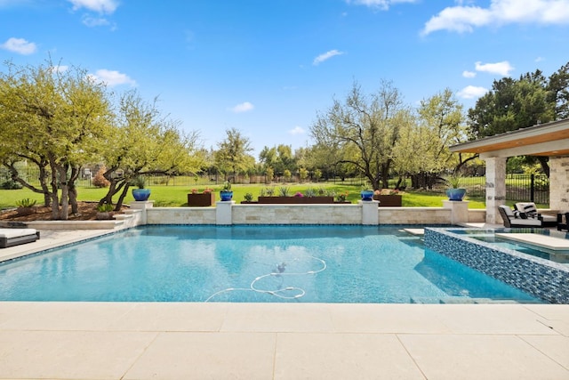 view of swimming pool featuring a pool with connected hot tub