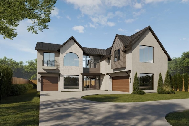 view of front of house featuring a balcony, a front yard, a garage, a standing seam roof, and metal roof