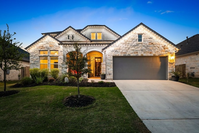 134 Soft Elm Dr, Buda, TX 78610 - french provincial home with stone siding, an attached garage, and concrete driveway