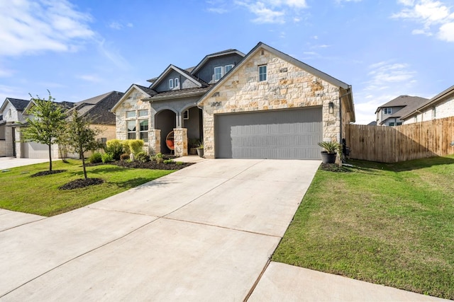 134 Soft Elm Dr, Buda, TX 78610 - view of front of home featuring stone siding, a garage, and driveway