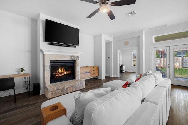 134 Soft Elm Dr, Buda, TX 78610 - living room with ceiling fan, a glass covered fireplace, wood finished floors, and baseboards
