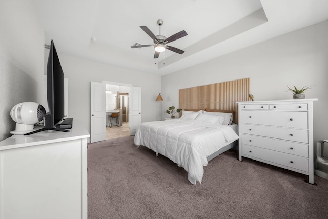 134 Soft Elm Dr, Buda, TX 78610 - bedroom featuring carpet flooring, ceiling fan, and a tray ceiling