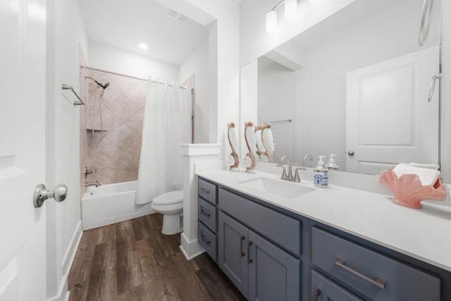 134 Soft Elm Dr, Buda, TX 78610 - full bathroom with toilet, wood finished floors, vanity, and shower / bath combination with curtain