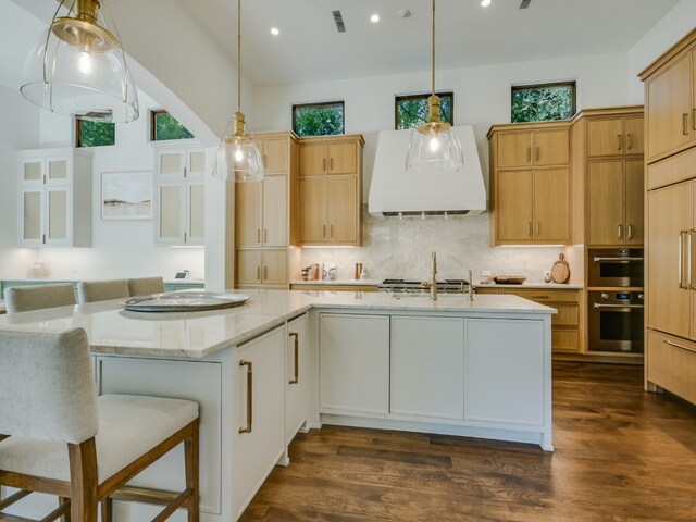 1614 Bruton Springs Rd, Austin, TX 78733 - kitchen featuring ventilation hood, recessed lighting, stainless steel double oven, dark wood-style flooring, and backsplash