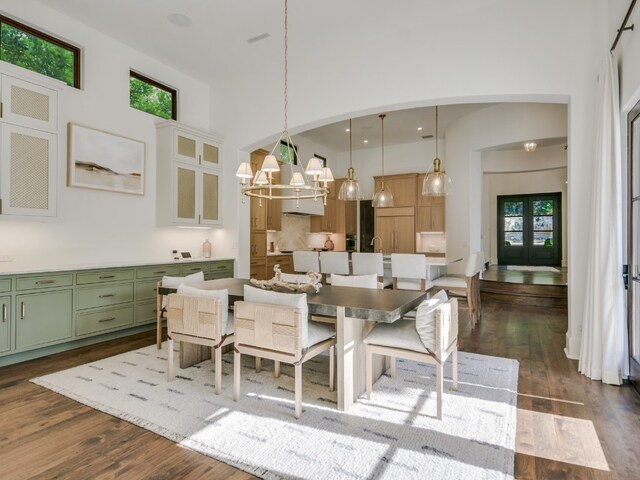 1614 Bruton Springs Rd, Austin, TX 78733 - dining area featuring dark wood finished floors and a towering ceiling