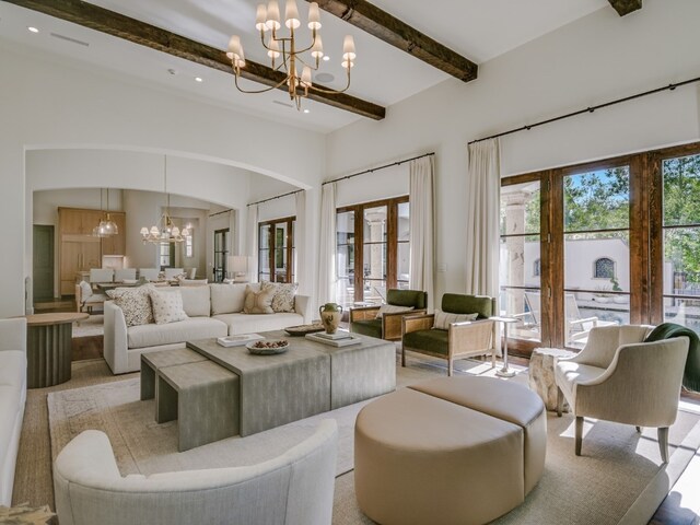 1614 Bruton Springs Rd, Austin, TX 78733 - living area featuring a chandelier, arched walkways, and recessed lighting