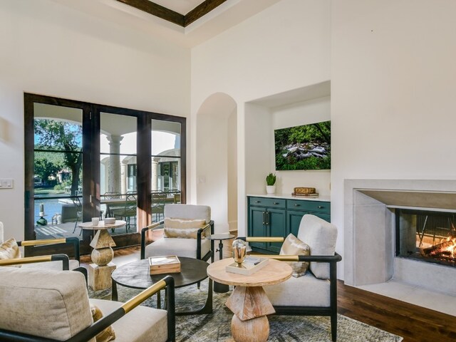 1614 Bruton Springs Rd, Austin, TX 78733 - living room with dark wood-style floors, a fireplace with flush hearth, and a towering ceiling