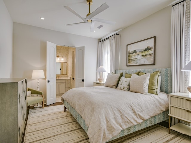 1614 Bruton Springs Rd, Austin, TX 78733 - bedroom featuring multiple windows, ensuite bath, recessed lighting, ceiling fan, and light wood-type flooring