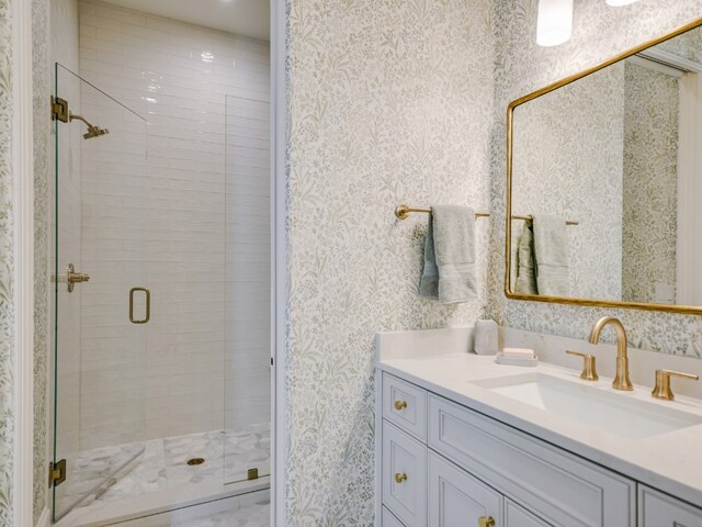 1614 Bruton Springs Rd, Austin, TX 78733 - bathroom with wallpapered walls, vanity, and a shower stall