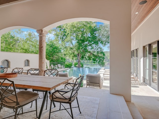 1614 Bruton Springs Rd, Austin, TX 78733 - view of patio / terrace featuring an infinity pool