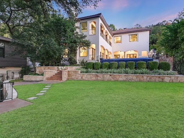1614 Bruton Springs Rd, Austin, TX 78733 - back of house with stucco siding and a tiled roof
