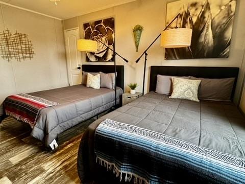 bedroom with wood finished floors