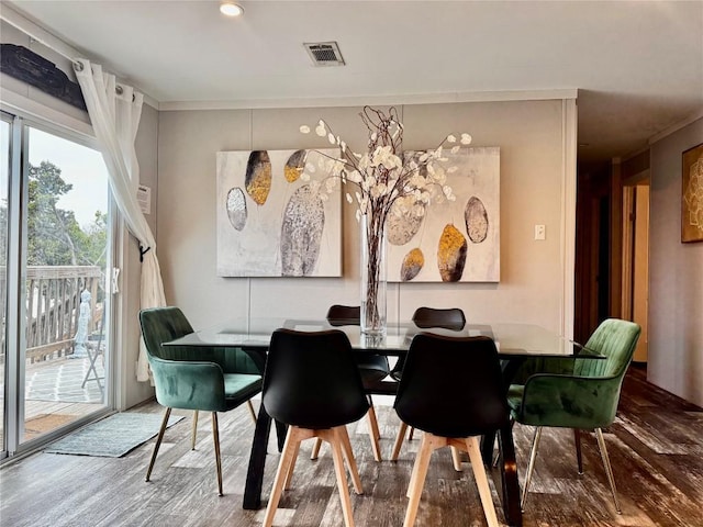 dining area with recessed lighting, wood finished floors, visible vents, and ornamental molding