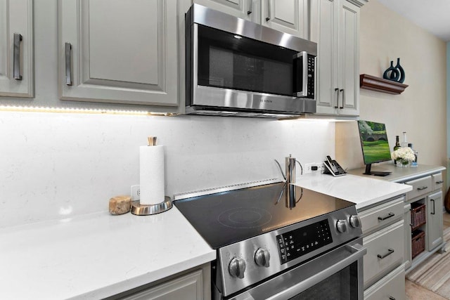 108 Silver Bonnet Dr, Georgetown, TX 78633 - kitchen featuring stainless steel appliances and gray cabinetry