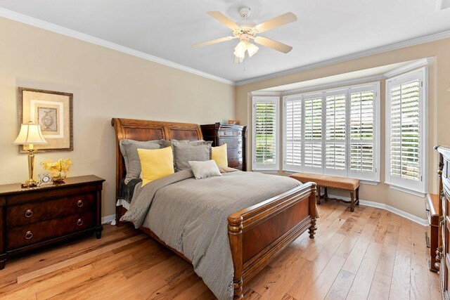 108 Silver Bonnet Dr, Georgetown, TX 78633 - bedroom with ornamental molding, light wood-style floors, and a ceiling fan