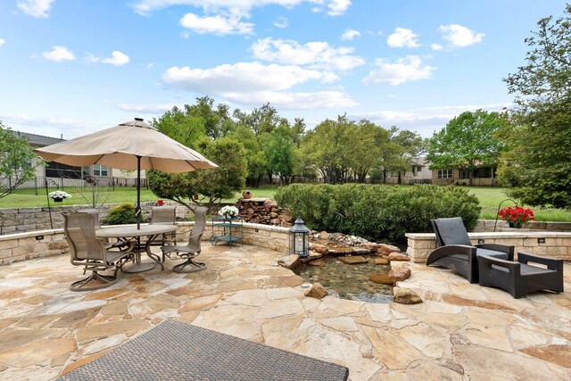 108 Silver Bonnet Dr, Georgetown, TX 78633 - view of patio featuring outdoor dining space