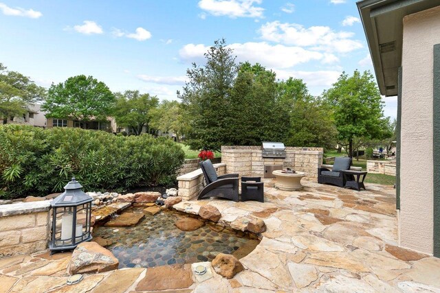 108 Silver Bonnet Dr, Georgetown, TX 78633 - view of patio / terrace with exterior kitchen
