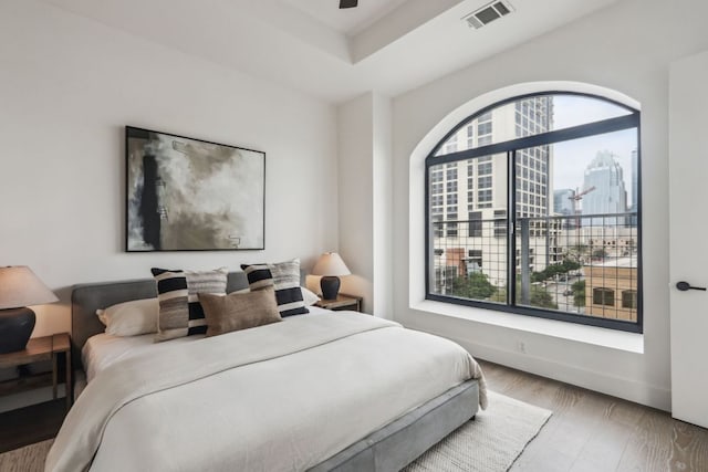507 Sabine St Unit 601, Austin, TX 78701 - bedroom with a view of city and wood finished floors