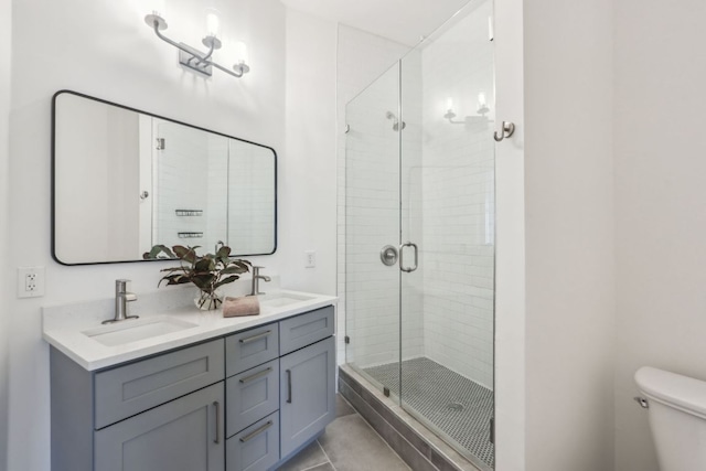 507 Sabine St Unit 601, Austin, TX 78701 - full bath featuring a stall shower, double vanity, and toilet