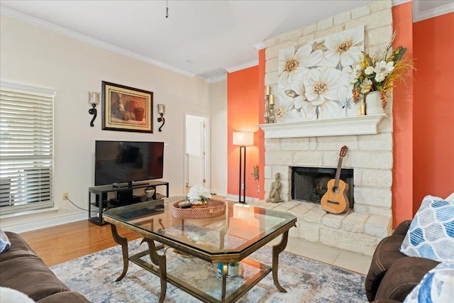 125 Fairway Ct, Bastrop, TX 78602 - living area featuring ornamental molding, a fireplace, and wood finished floors
