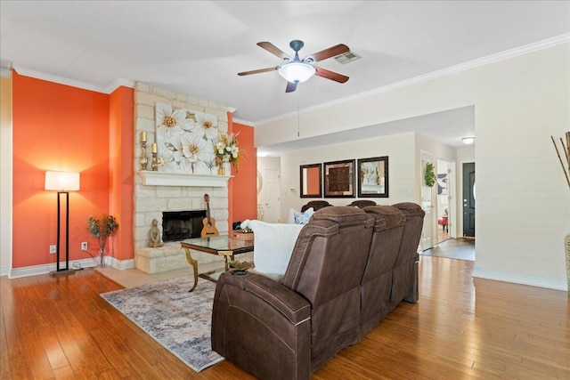 125 Fairway Ct, Bastrop, TX 78602 - living area with ceiling fan, ornamental molding, hardwood / wood-style floors, and a fireplace