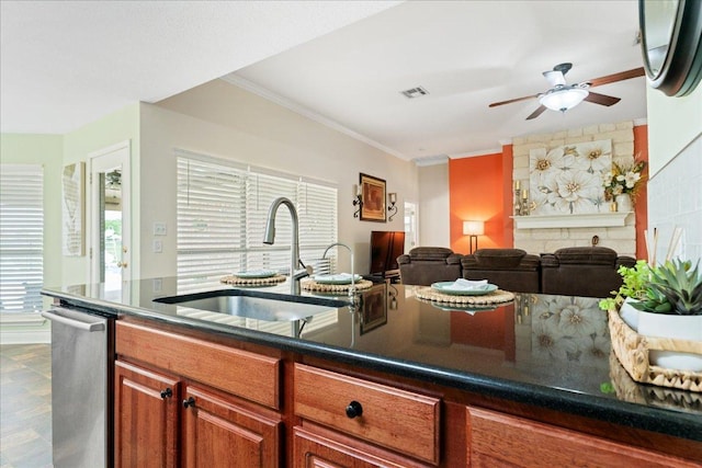125 Fairway Ct, Bastrop, TX 78602 - kitchen with ceiling fan, dishwasher, ornamental molding, open floor plan, and dark countertops
