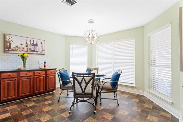 125 Fairway Ct, Bastrop, TX 78602 - dining room featuring a chandelier and baseboards