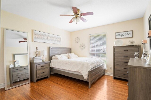 125 Fairway Ct, Bastrop, TX 78602 - bedroom with light wood-style floors and ceiling fan