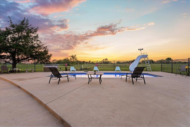 125 Fairway Ct, Bastrop, TX 78602 - view of swimming pool with a water slide and a patio