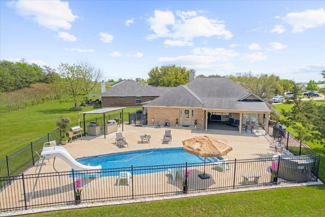 125 Fairway Ct, Bastrop, TX 78602 - view of pool with a water slide and a patio area