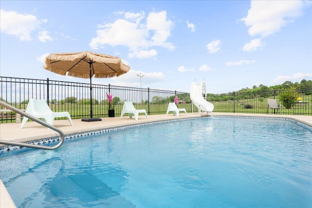 125 Fairway Ct, Bastrop, TX 78602 - view of swimming pool featuring a water slide and a patio area