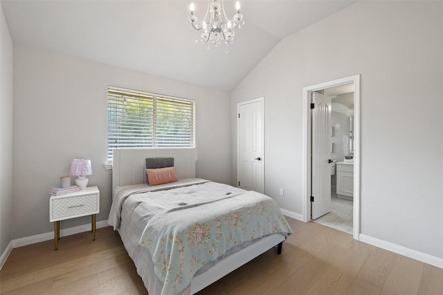 611 Ladin Ln, Lakeway, TX 78734 - bedroom with light wood-style flooring, lofted ceiling, a chandelier, and connected bathroom