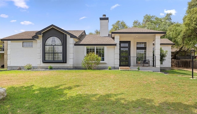 611 Ladin Ln, Lakeway, TX 78734 - rear view of property featuring a chimney and roof with shingles