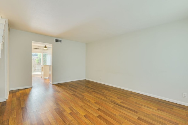 7409 Shadow Hill Dr Unit 105, Austin, TX 78731 - spare room featuring wood finished floors and baseboards