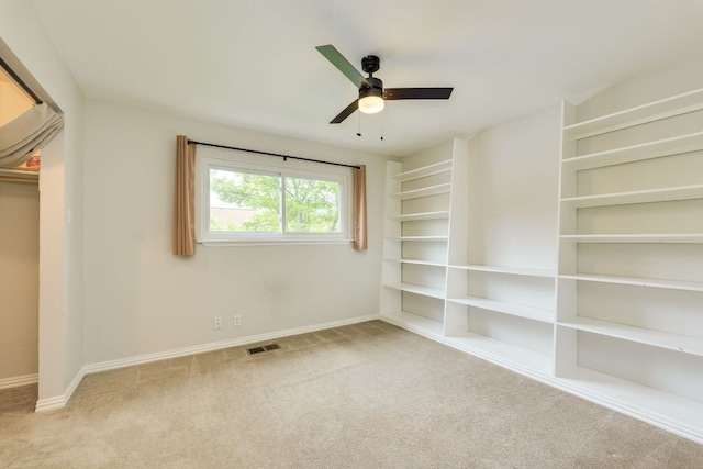 7409 Shadow Hill Dr Unit 105, Austin, TX 78731 - unfurnished bedroom with carpet flooring, baseboards, and ceiling fan